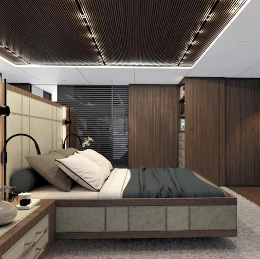 a bed with a wooden frame aboard HORIZON II Yacht for Sale
