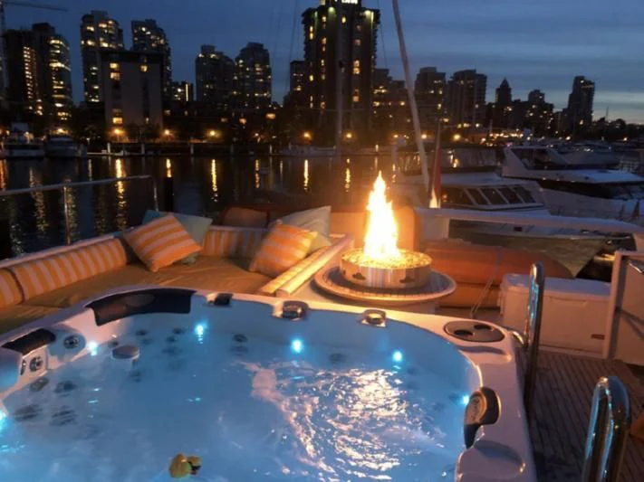 a pool with a fire in it aboard SOVEREIGN LADY Yacht for Sale