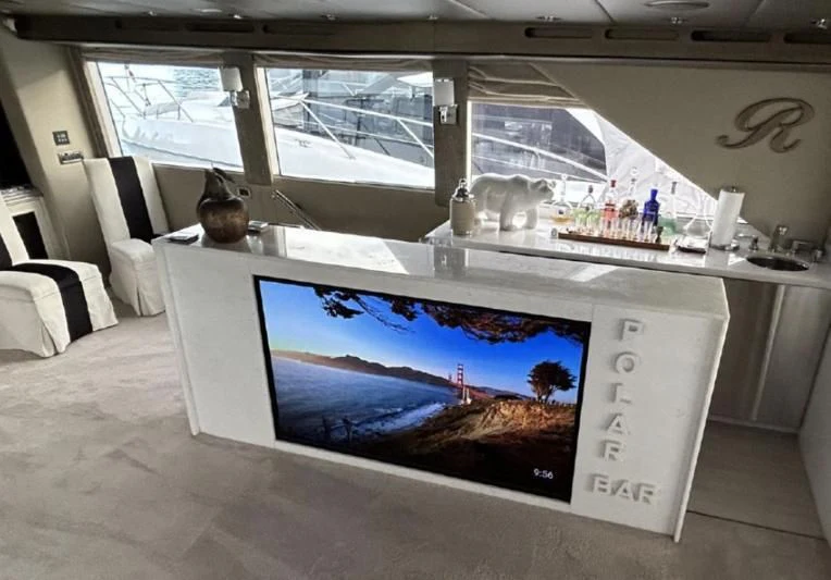 a large screen on a table aboard SOVEREIGN LADY Yacht for Sale