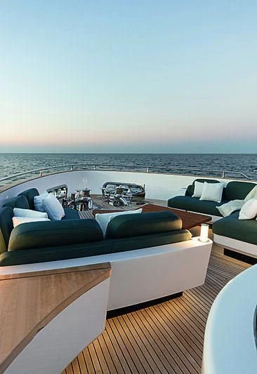 a room with a bed and a couch aboard JAKAT Yacht for Sale