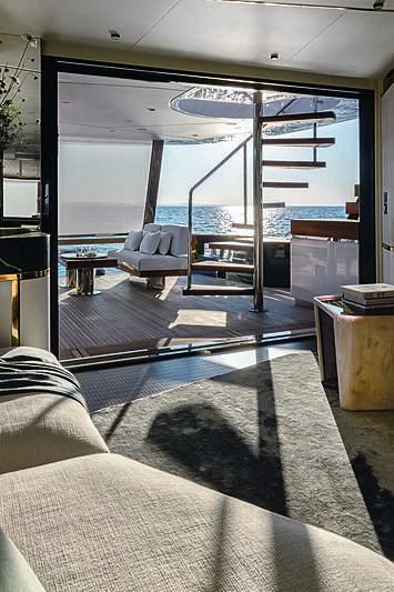 a room with a glass door aboard JAKAT Yacht for Sale