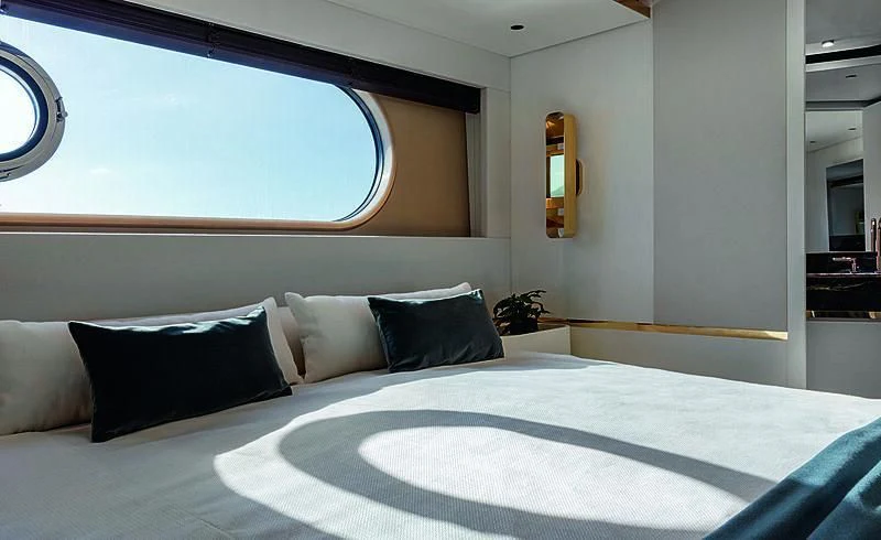 a bed with pillows aboard JAKAT Yacht for Sale
