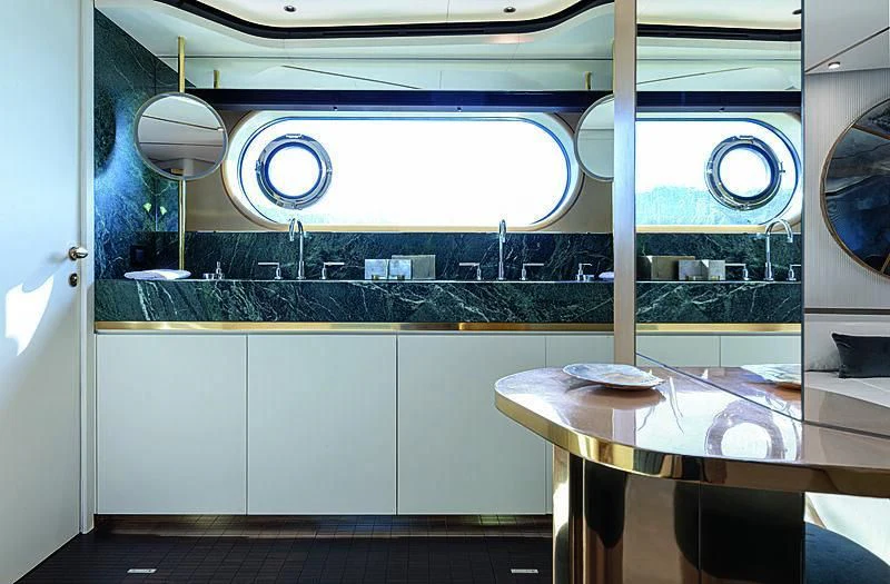 a kitchen with a large window aboard JAKAT Yacht for Sale