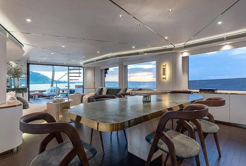 a large kitchen with a large table aboard JAKAT Yacht for Sale