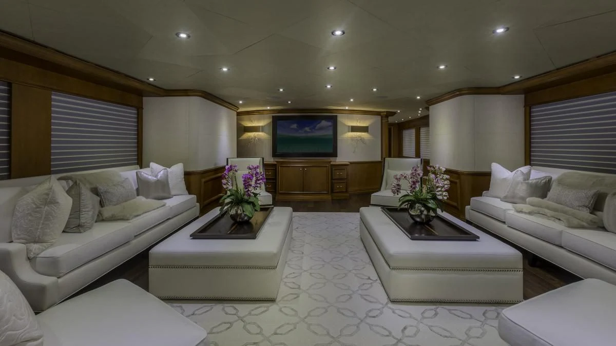 a living room with white furniture aboard M3 Yacht for Sale