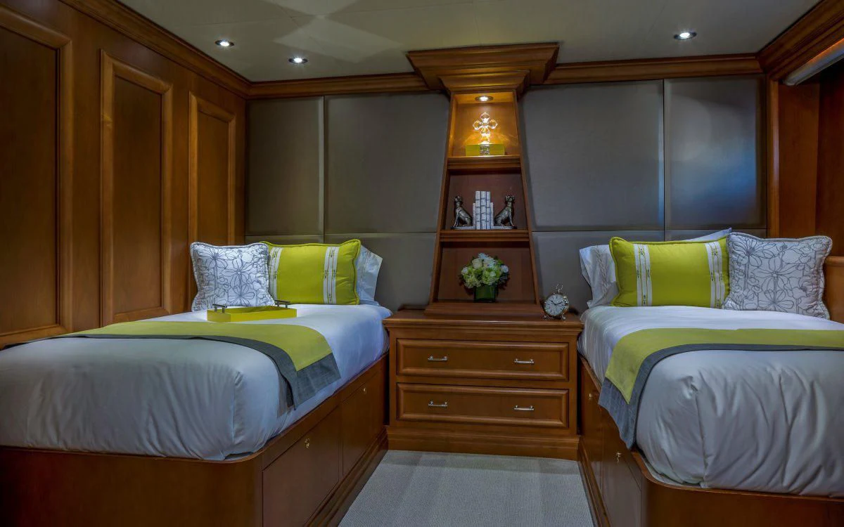 a room with two beds aboard M3 Yacht for Sale