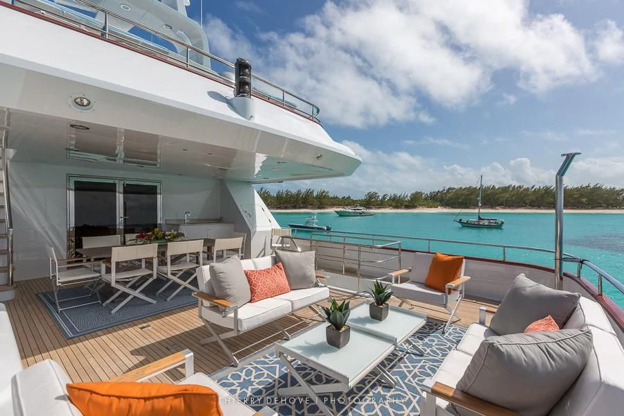 a living room with a large swimming pool aboard M3 Yacht for Sale