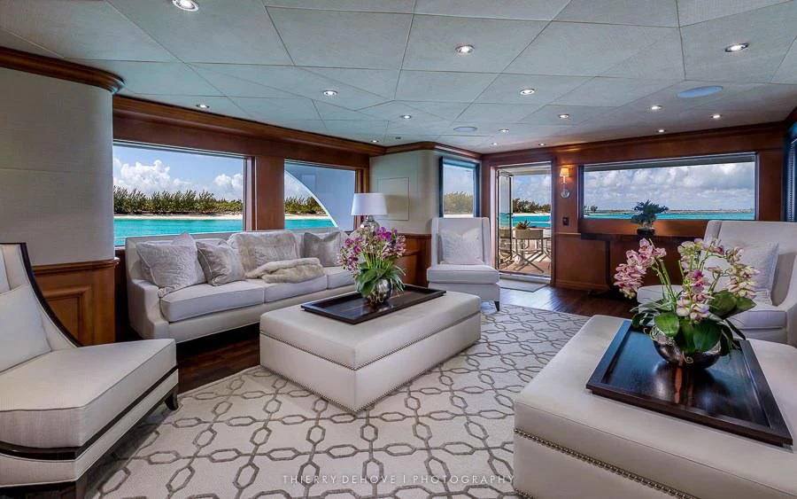 a living room with a large window aboard M3 Yacht for Sale