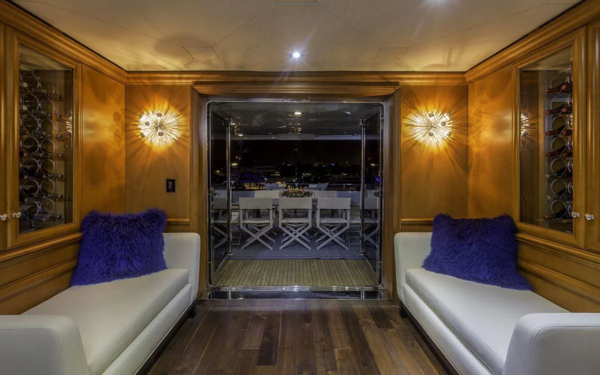 a living room with a large glass door aboard M3 Yacht for Sale
