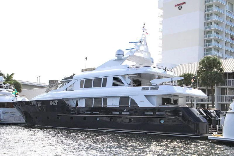 a large white boat on the beach aboard M3 Yacht for Sale