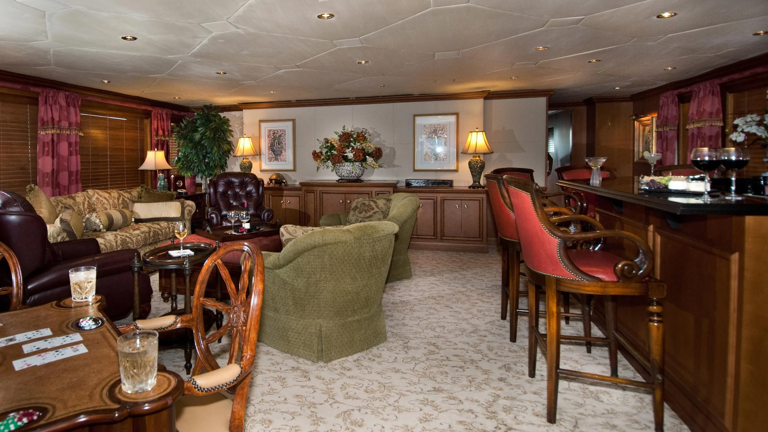 a living room with a couch and chairs aboard M3 Yacht for Sale