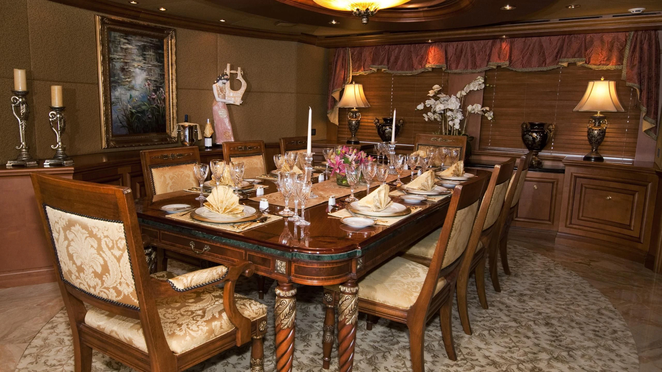a dining room with a table set aboard M3 Yacht for Sale