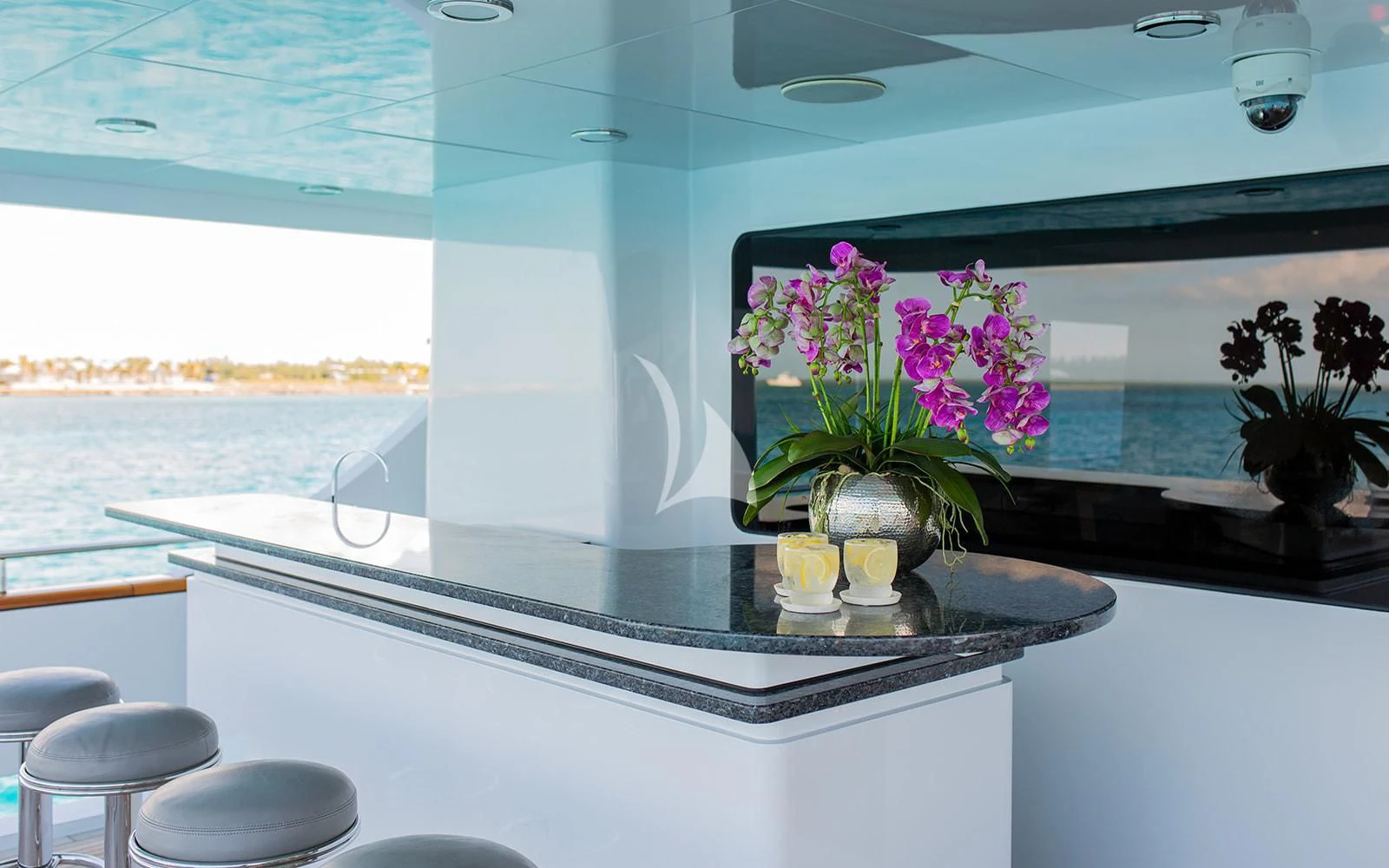 a room with a table and chairs aboard M3 Yacht for Sale