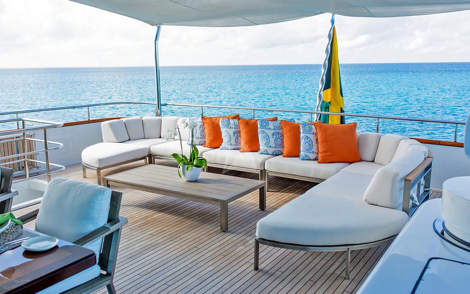 a patio with a table and chairs aboard M3 Yacht for Sale
