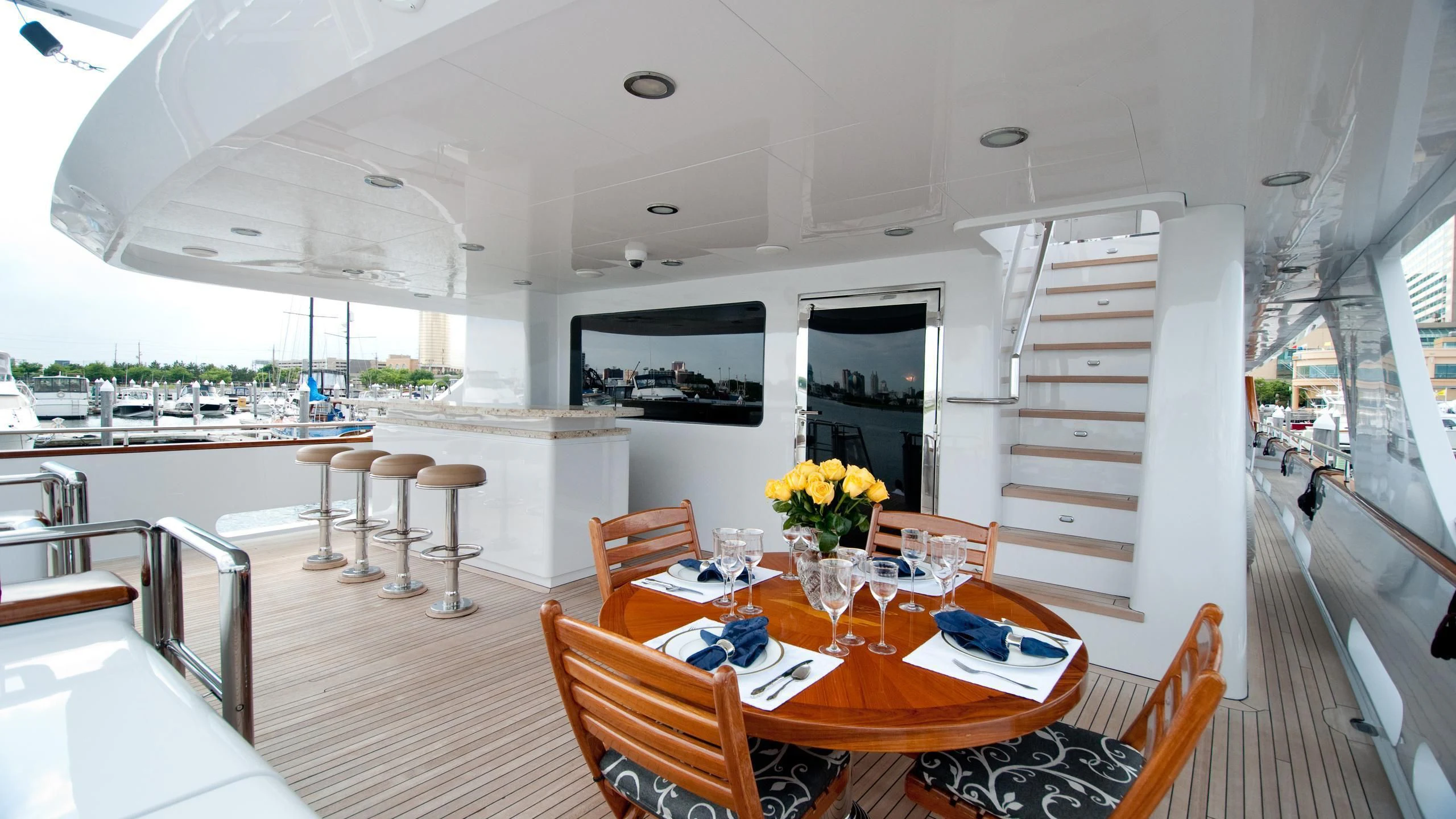 a dining table and chairs on a boat aboard M3 Yacht for Sale