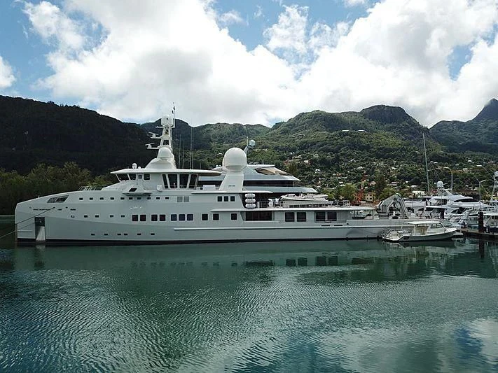 a large white boat in a body of water aboard UM ALHOUL Yacht for Sale