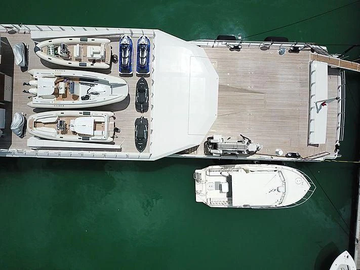 a white car with a blue door aboard UM ALHOUL Yacht for Sale