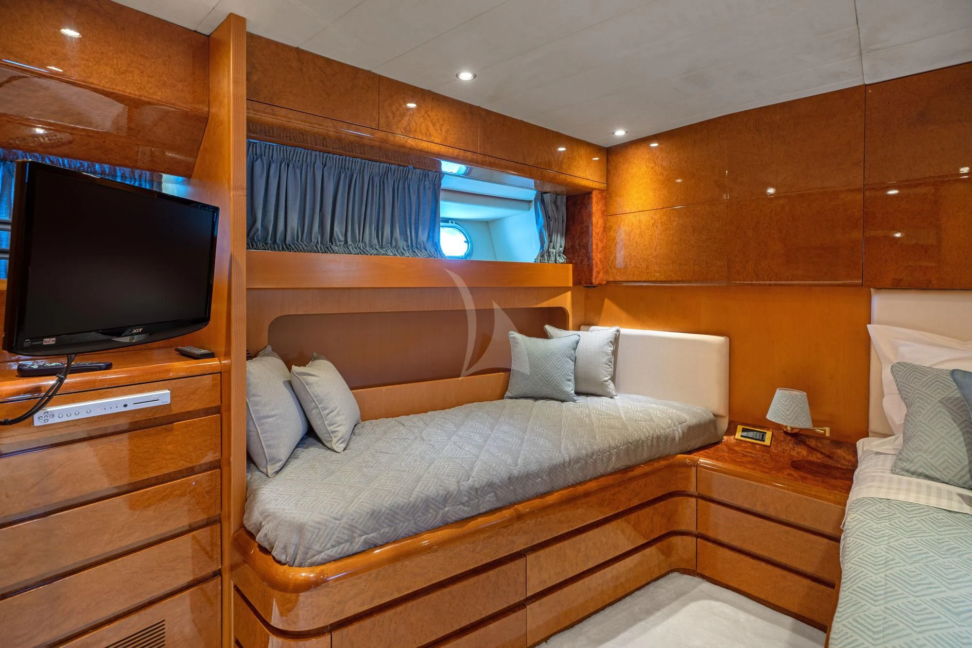 a bedroom with a bed and a television aboard ALANDINI Yacht for Sale