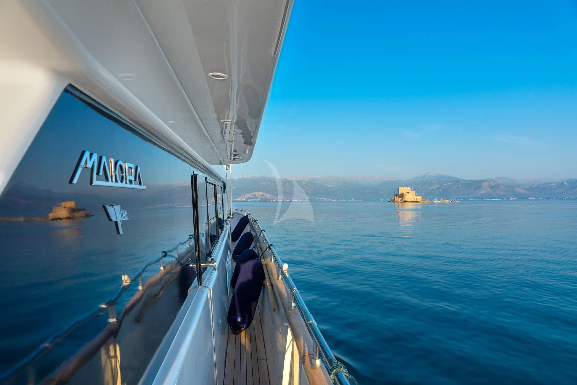 a person sitting on a boat aboard ALANDINI Yacht for Sale