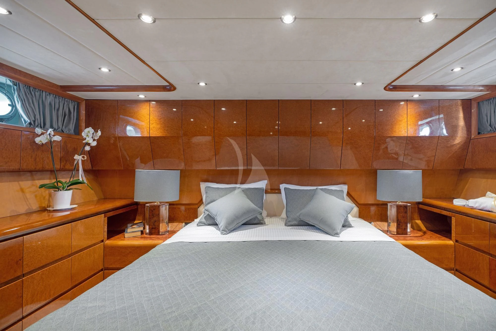 a bed with white sheets and pillows aboard ALANDINI Yacht for Sale