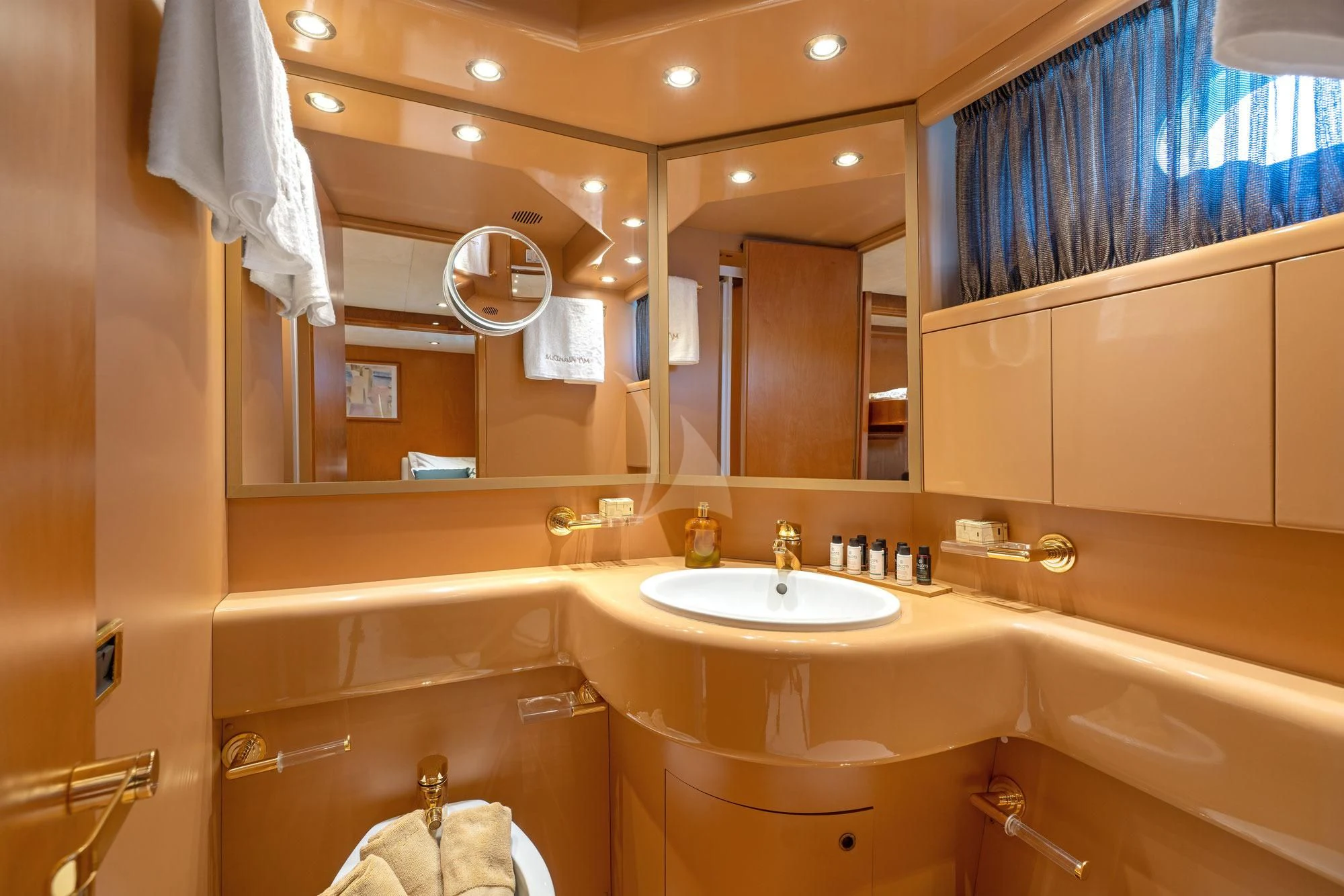 a bathroom with a sink and a mirror aboard ALANDINI Yacht for Sale