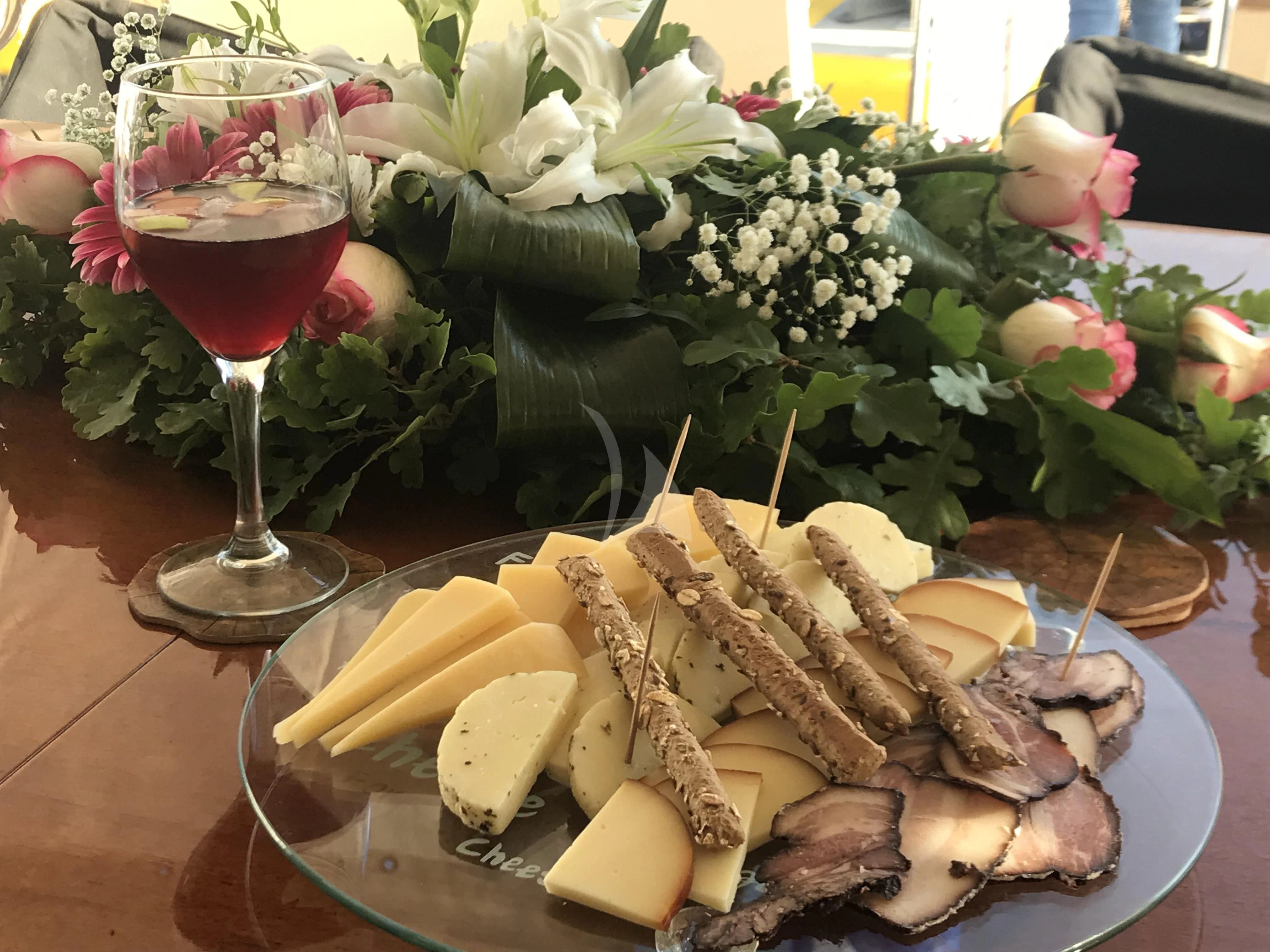 a plate of food and a glass of wine aboard ALANDINI Yacht for Sale
