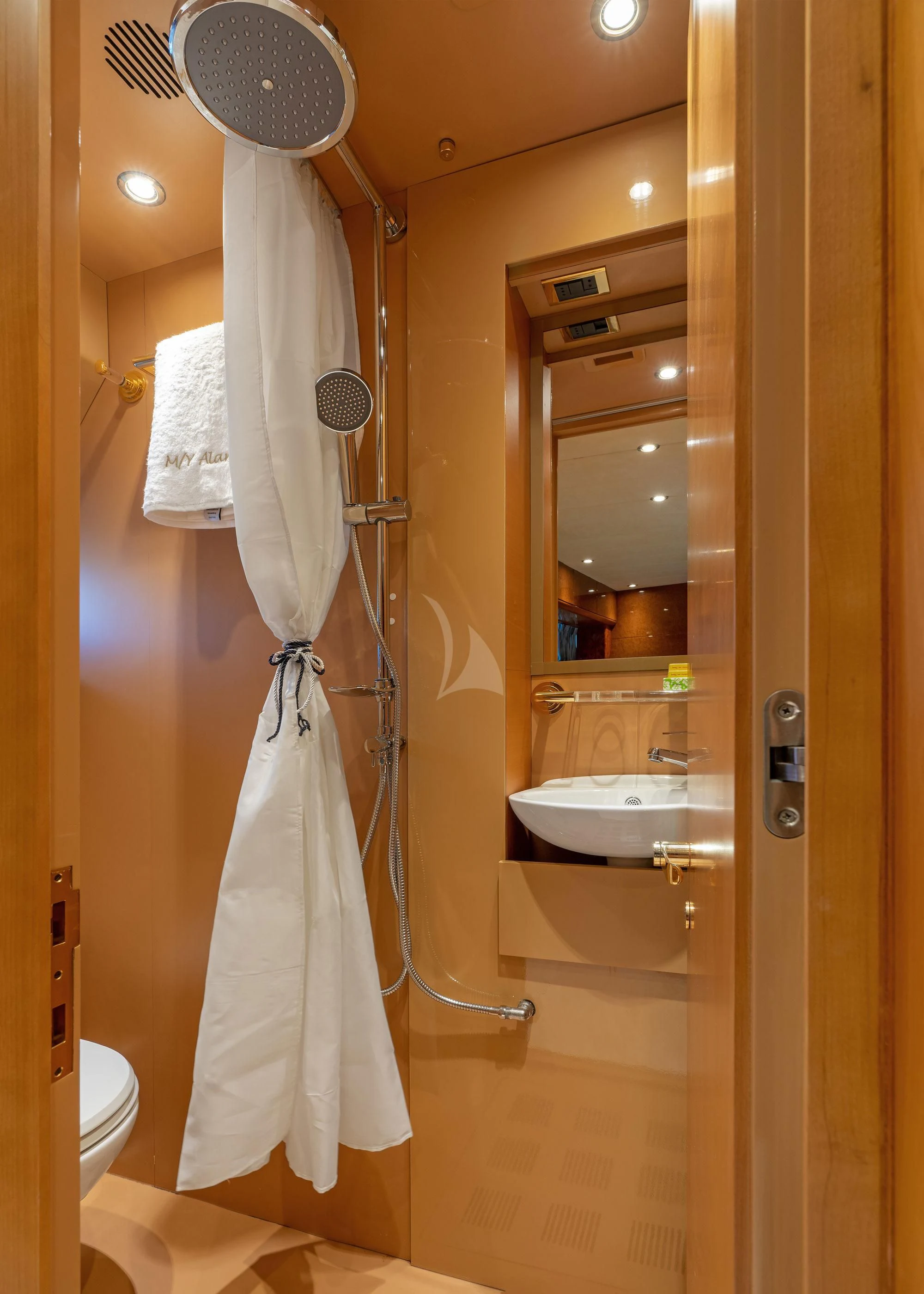 a bathroom with a shower curtain aboard ALANDINI Yacht for Sale