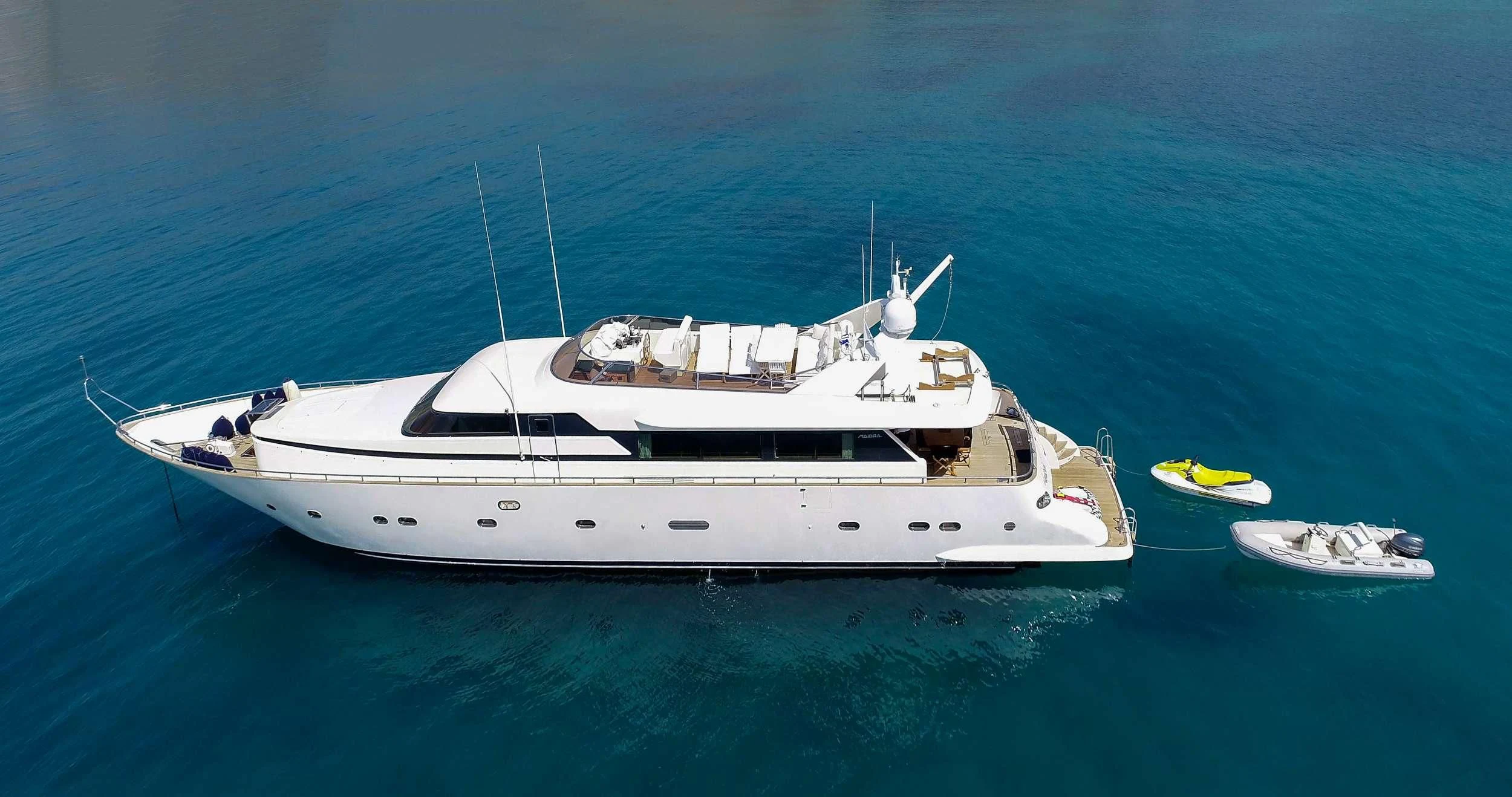 a white yacht in the ocean aboard ALANDINI Yacht for Sale