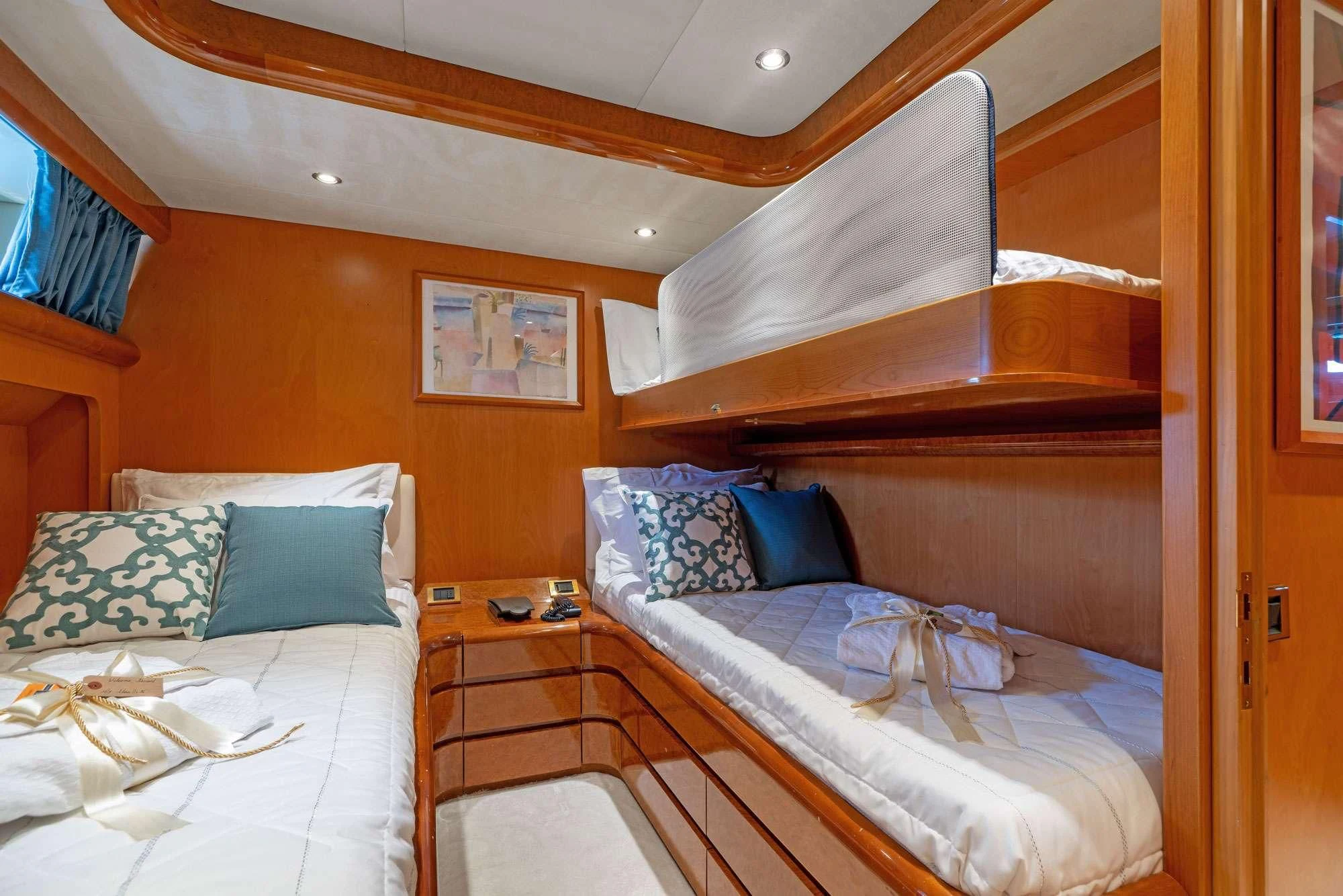 a couple of beds in a hotel room aboard ALANDINI Yacht for Sale