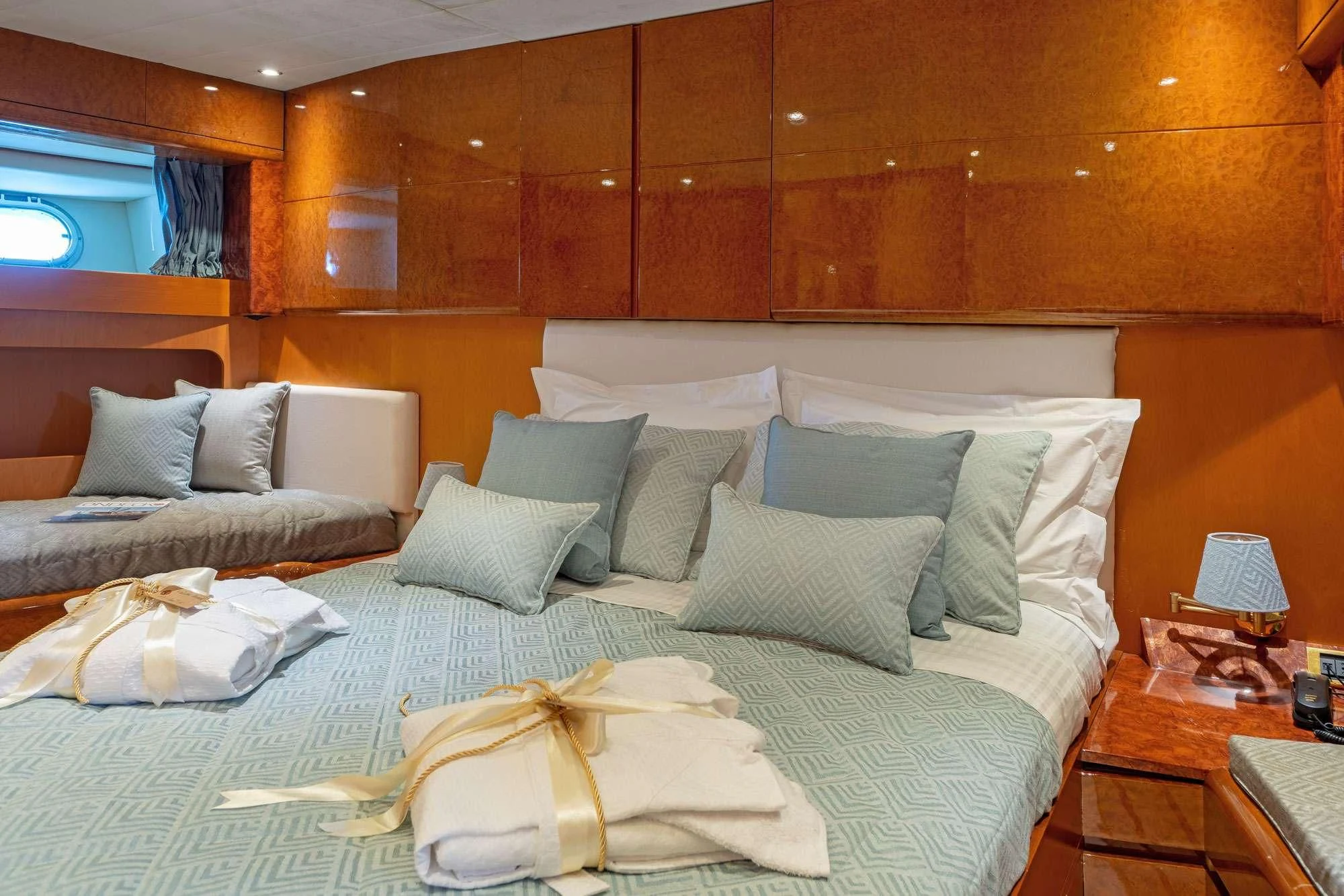 a bed with white pillows aboard ALANDINI Yacht for Sale