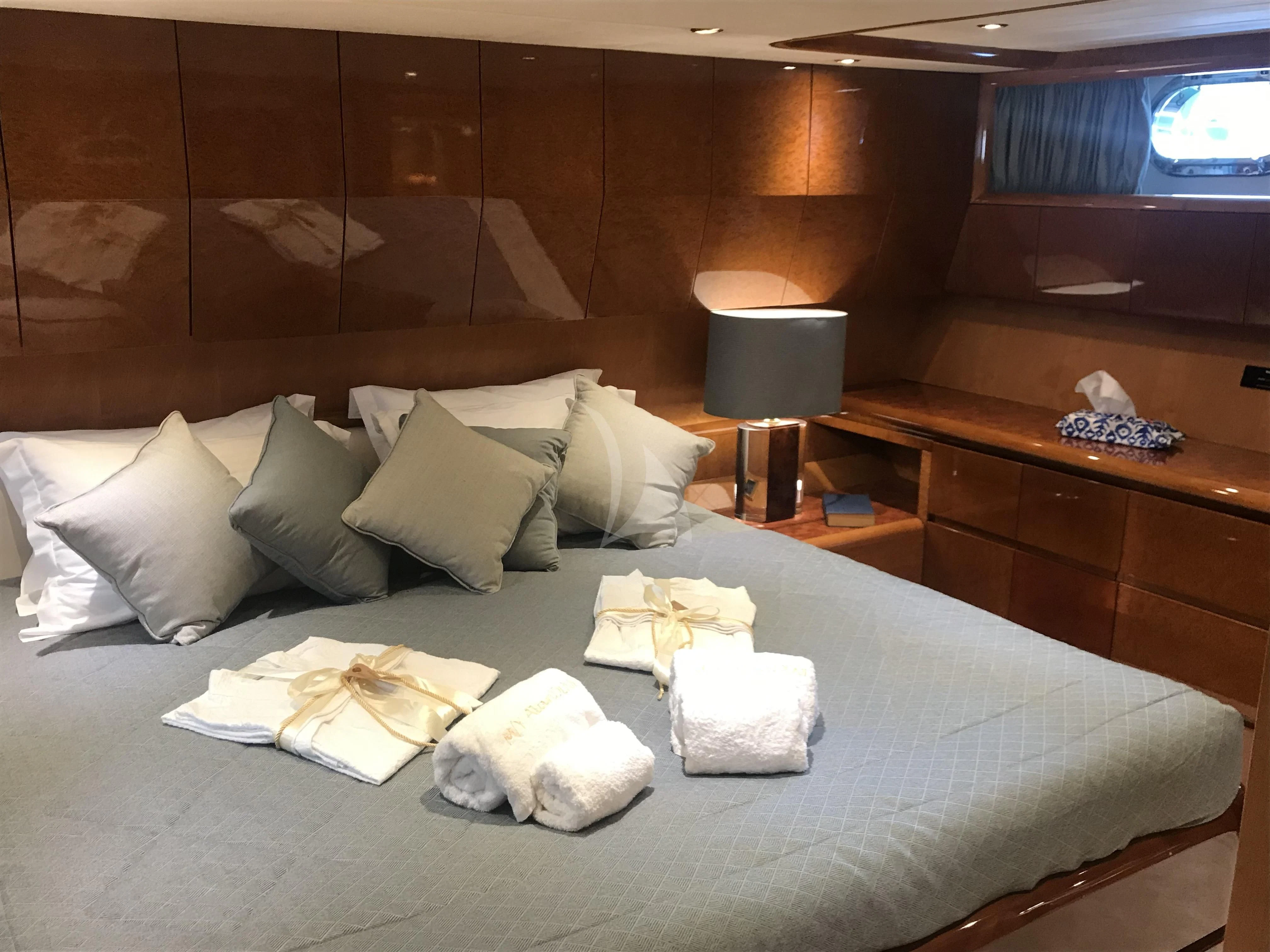 a bed with pillows and pillows aboard ALANDINI Yacht for Sale