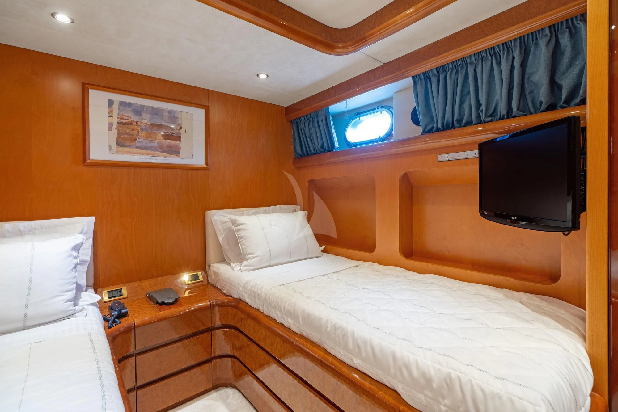 a room with a bed and a television aboard ALANDINI Yacht for Sale
