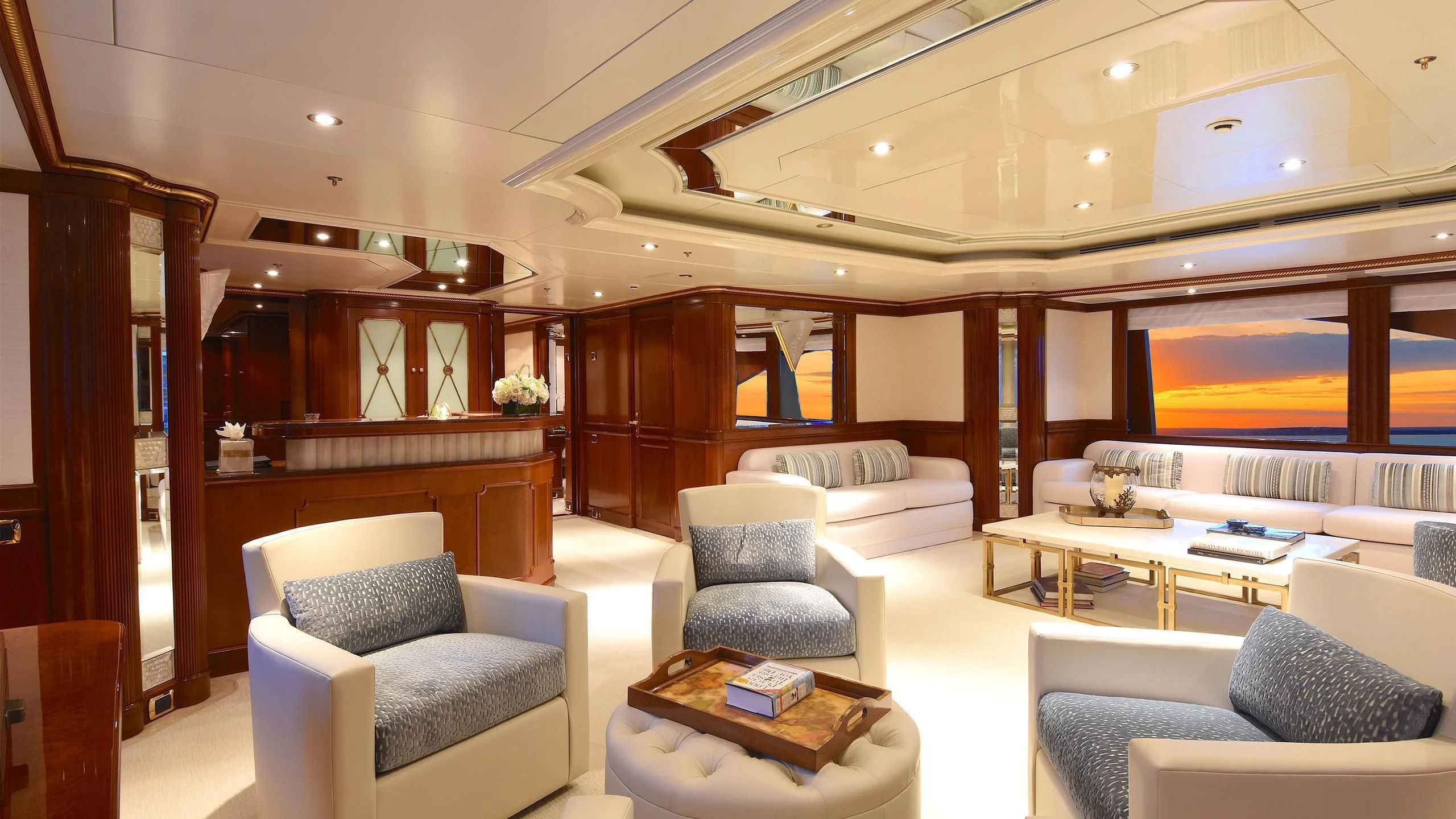 a room with a couch and a table aboard NEXT CHAPTER Yacht for Sale