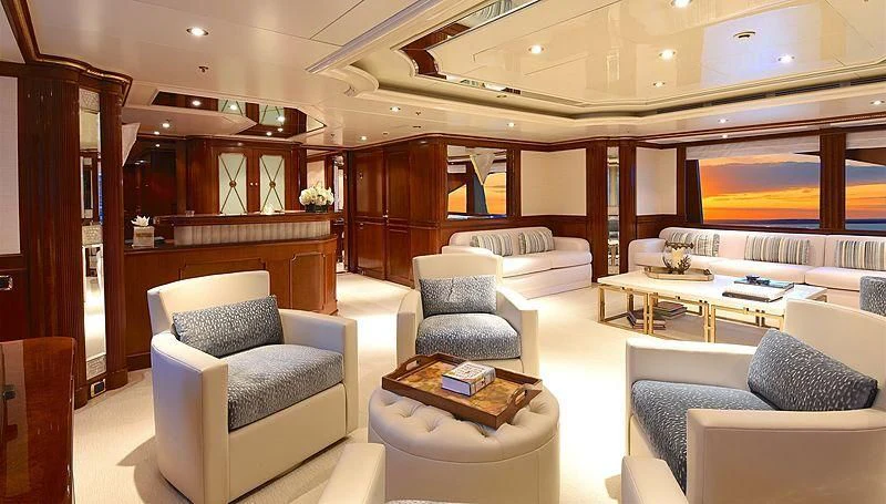 a room with a couch and a table aboard NEXT CHAPTER Yacht for Sale