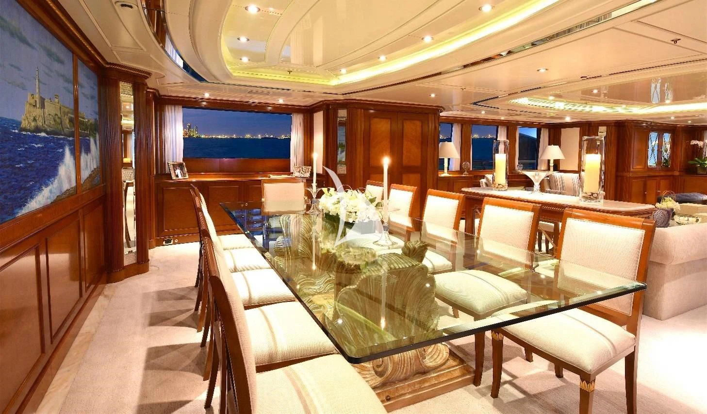 a room with a table chairs and a large window aboard NEXT CHAPTER Yacht for Sale