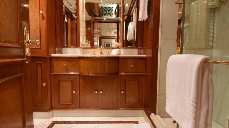 a bathroom with a sink and a mirror aboard NEXT CHAPTER Yacht for Sale