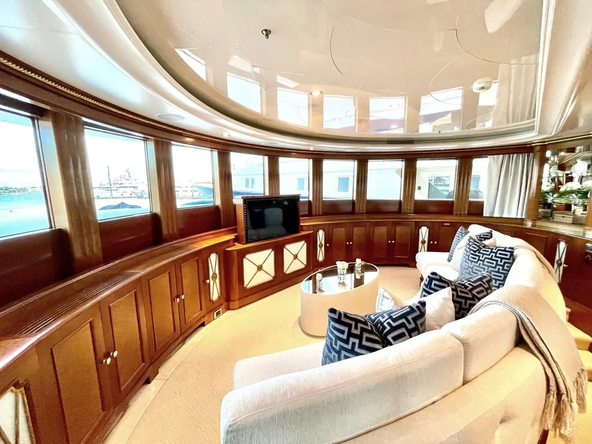 a room with a couch and a television aboard NEXT CHAPTER Yacht for Sale