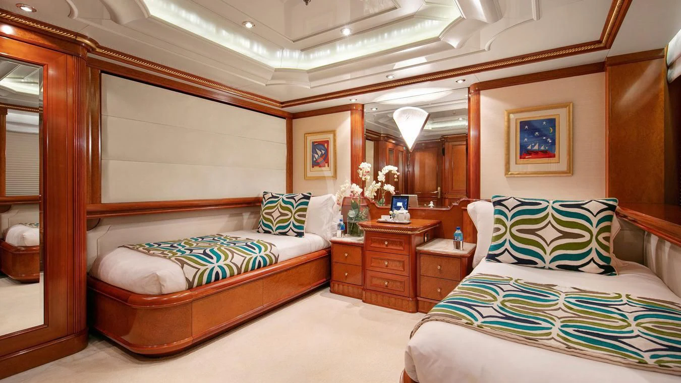 a room with two beds aboard NEXT CHAPTER Yacht for Sale