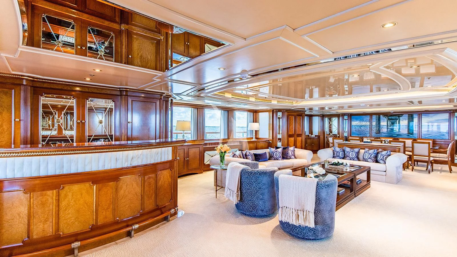a large room with a couch and a table aboard NEXT CHAPTER Yacht for Sale