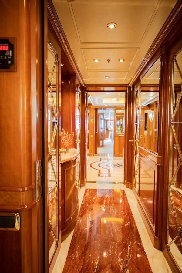 a hallway with glass doors aboard NEXT CHAPTER Yacht for Sale