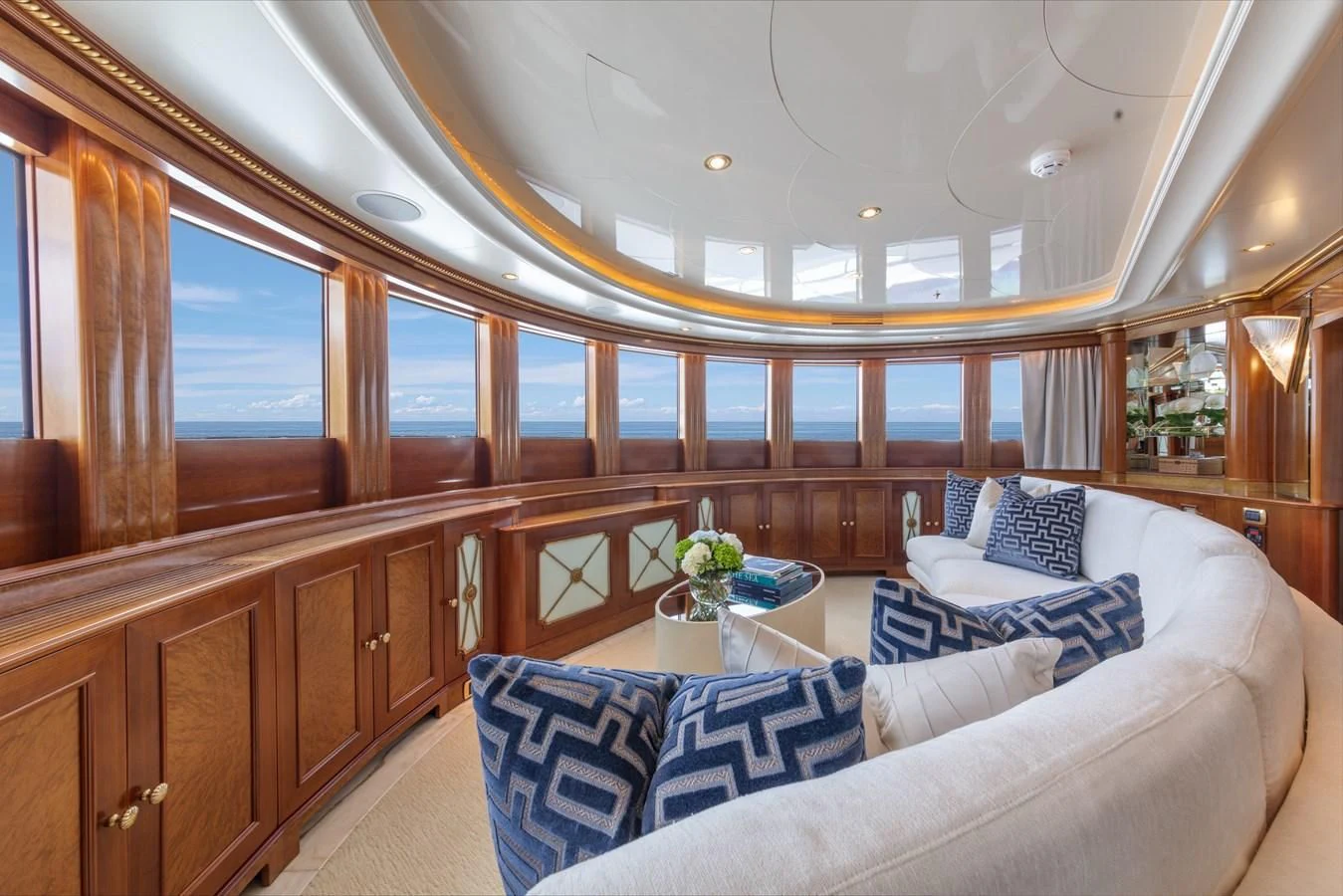 a room with a couch and a table aboard NEXT CHAPTER Yacht for Sale