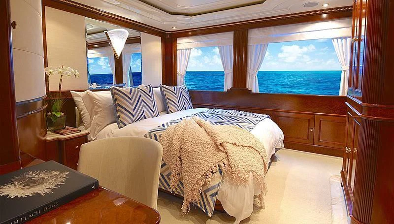 a room with a bed and a window aboard NEXT CHAPTER Yacht for Sale