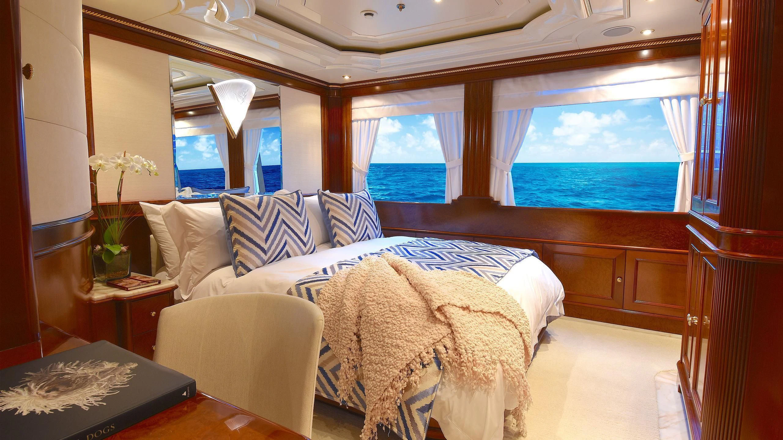 a room with a bed and a window aboard NEXT CHAPTER Yacht for Sale