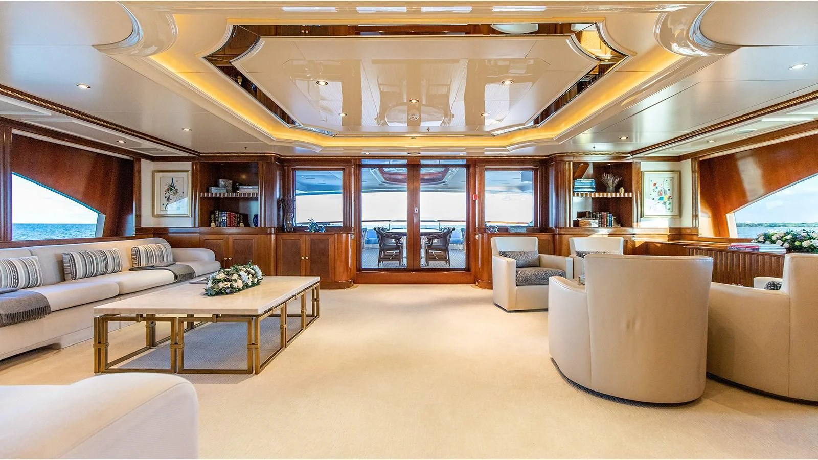 a room with couches and a table aboard NEXT CHAPTER Yacht for Sale