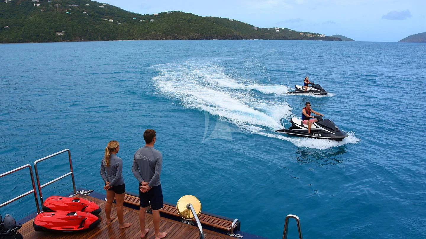 a group of people watching a boat race aboard NEXT CHAPTER Yacht for Sale
