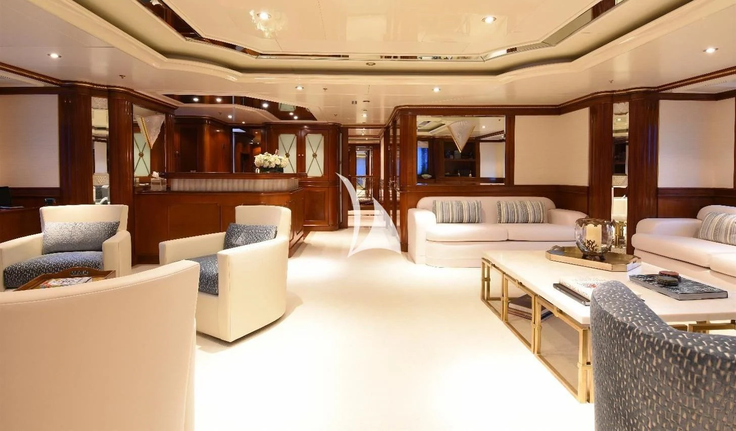a room with couches and a table aboard NEXT CHAPTER Yacht for Sale