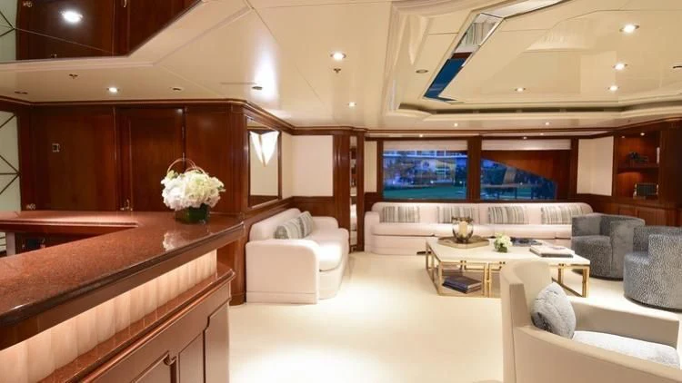 a room with a couch and a television aboard NEXT CHAPTER Yacht for Sale
