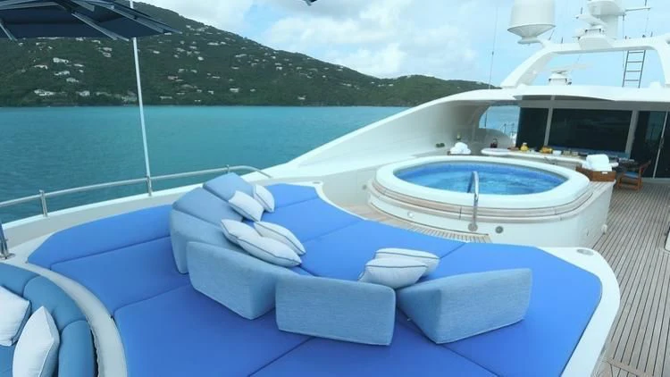 a boat on a deck aboard NEXT CHAPTER Yacht for Sale