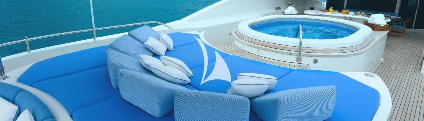 a white boat on a blue water body aboard NEXT CHAPTER Yacht for Sale