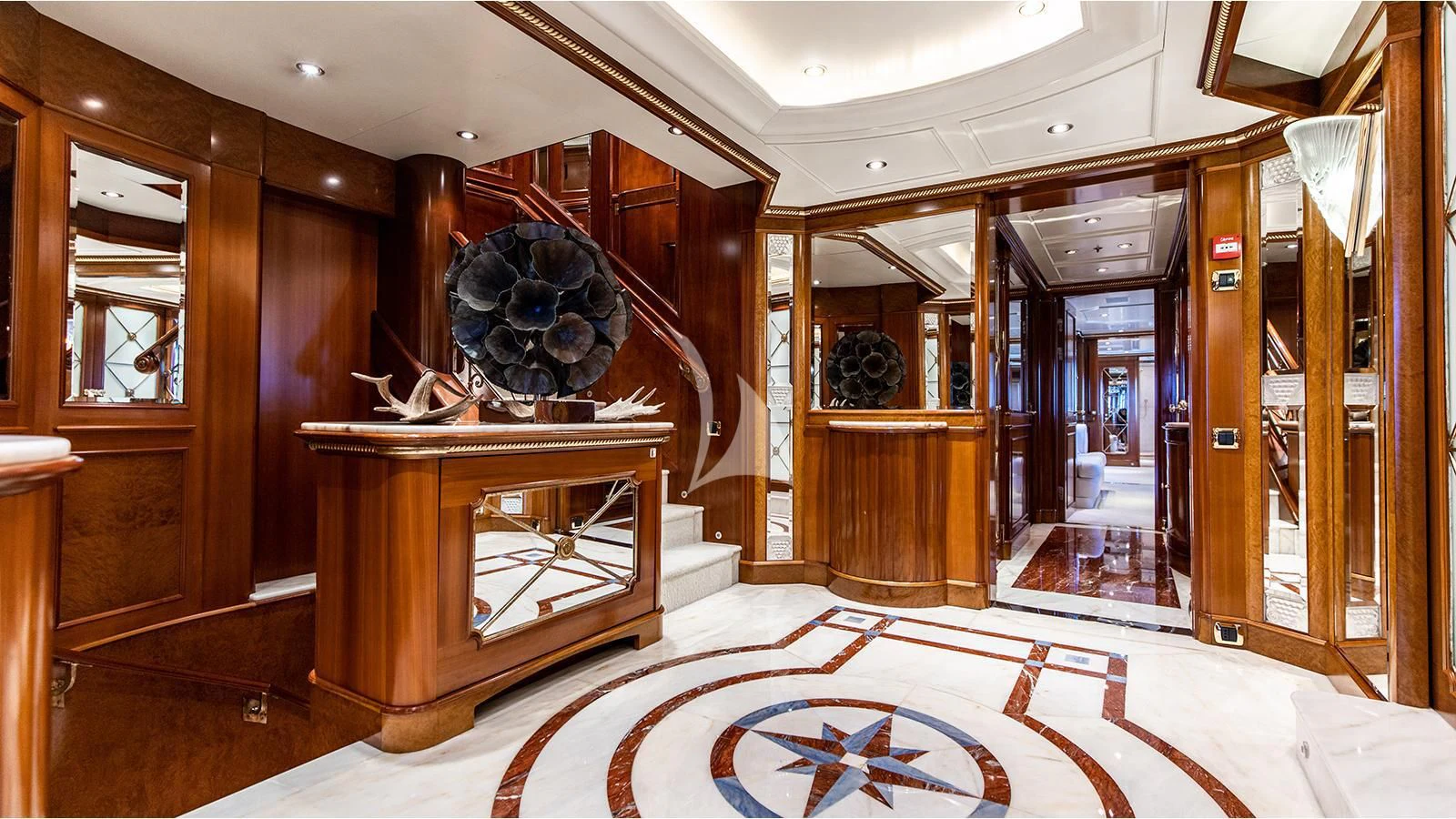 a room with a large mirror and a table aboard NEXT CHAPTER Yacht for Sale